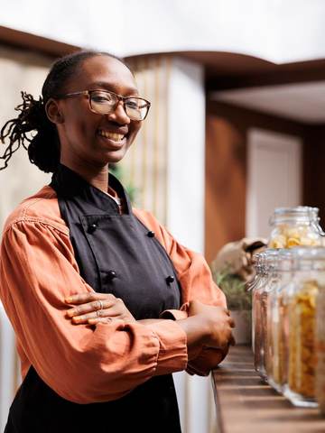 A shopkeeper in her store