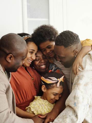 A family holding each other close
