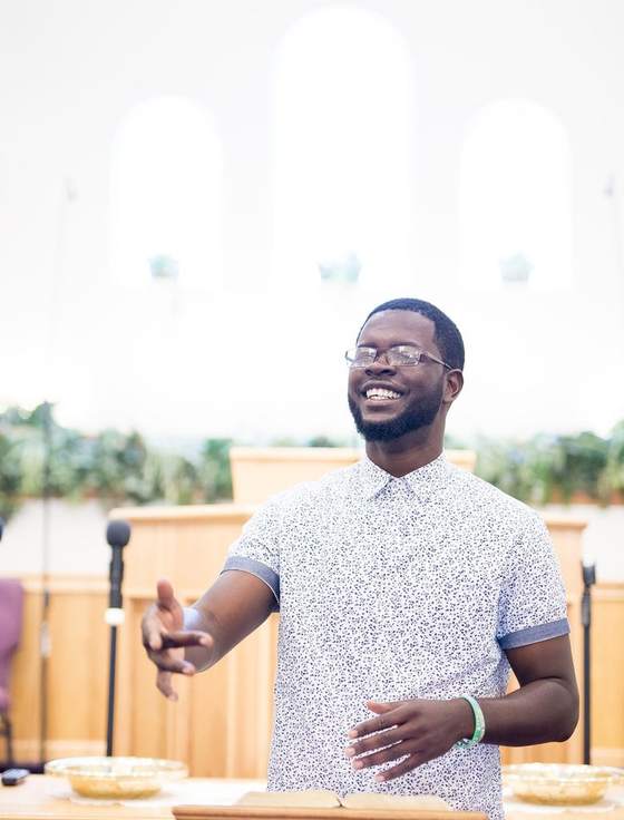A pastor speaking to his congregation