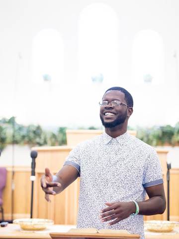 A pastor speaking to his congregation